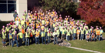 Group photo of Dynalectric Colorado employees in safety gear.